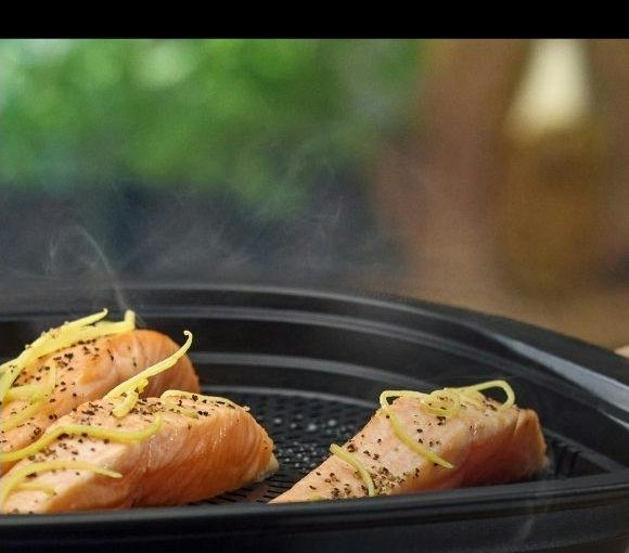 Salmon fillets steaming with herbs in the Thermomix Varoma